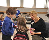 Mary visiting with students
